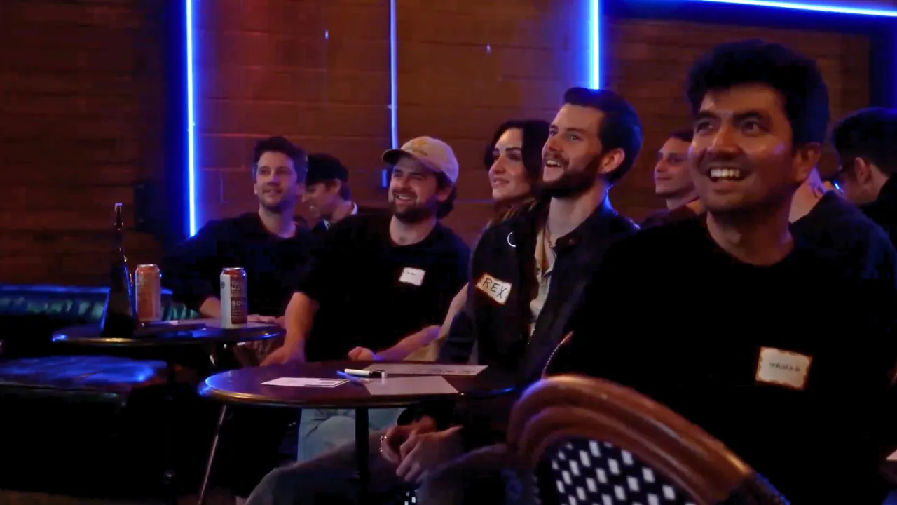 Audience members laughing during SideHustle LIVE at Pershing Hall